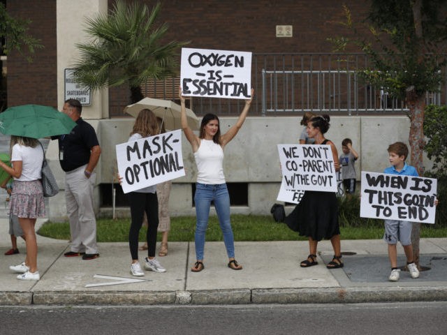 TAMPA, FL - JULY 27: Families protest any potential mask mandates before the Hillsborough