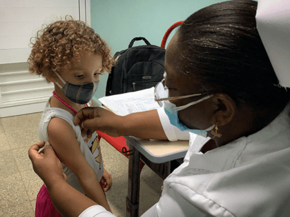 A nurse prepares Roxana Montano, 3, to receive her dose of Soberana Plus, a Cuban vaccine against Covid-19, on August 24, 2021 at Juan Manuel Marquez hospital in Havana, as part of the vaccine study in children and adolescents. (Photo by ADALBERTO ROQUE / AFP) (Photo by ADALBERTO ROQUE/AFP via …