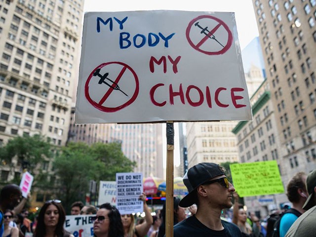 Protestors opposed to coronavirus vaccine mandates and vaccine passports by the government rally at City Hall in New York City on August 25, 2021. (Angela Weiss/AFP via Getty Images)