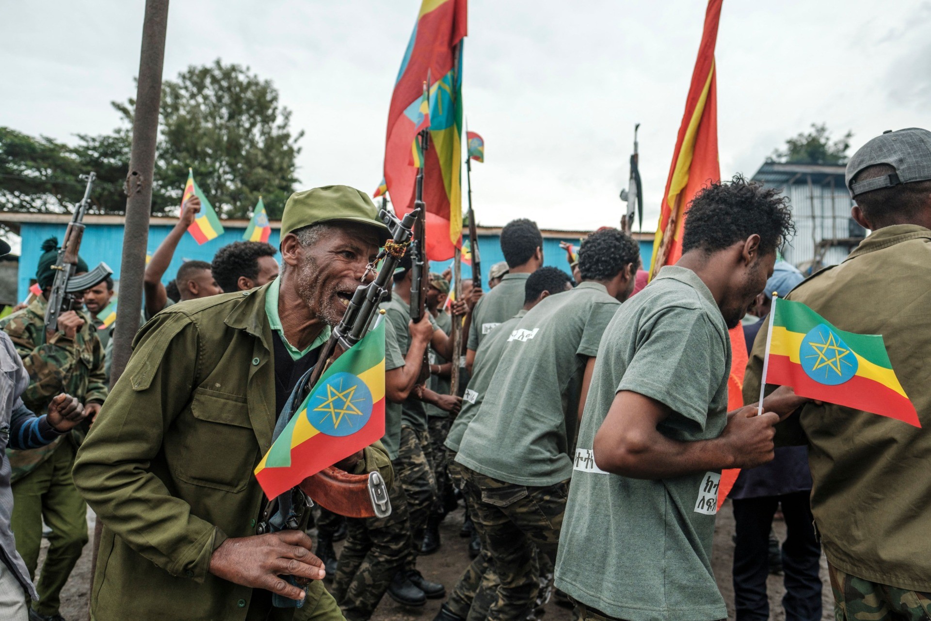 Recruits for reserves of Amhara regional forces, together with members of the Amhara militia, celebrate during their graduation ceremony, in the city of Dessie, Ethiopia, on August 24, 2021. - Long confined to Tigray, the conflict in Ethiopia has recently spread to two neighbouring regions, Afar and Amhara, with heavy weapons fire killing an untold number of civilians and displacing hundreds of thousands more. (Photo by EDUARDO SOTERAS / AFP) (Photo by EDUARDO SOTERAS/AFP via Getty Images)
