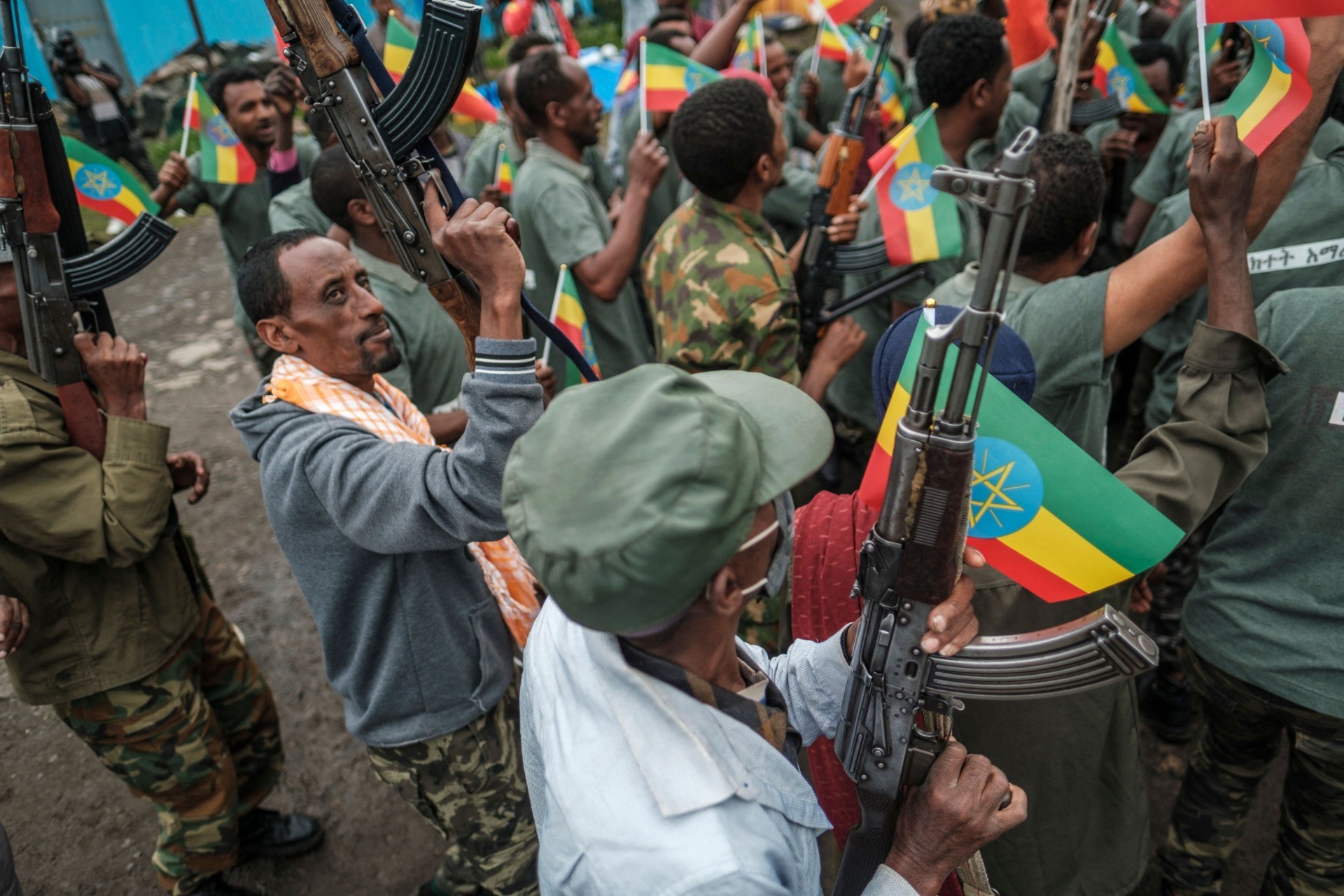 Recruits for reserves of Amhara regional forces, together with members of the Amhara militia, celebrate during their graduation ceremony, in the city of Dessie, Ethiopia, on August 24, 2021. - Long confined to Tigray, the conflict in Ethiopia has recently spread to two neighbouring regions, Afar and Amhara, with heavy weapons fire killing an untold number of civilians and displacing hundreds of thousands more. (Photo by EDUARDO SOTERAS / AFP) (Photo by EDUARDO SOTERAS/AFP via Getty Images)