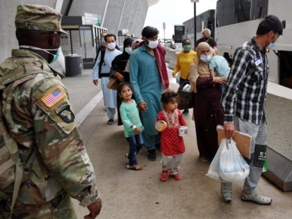 Afghan refugees board a bus after arriving at Dulles International Airport on August 27, 2021 in Dulles, Virginia after being evacuated from Kabul following the Taliban takeover of Afghanistan. - The Pentagon said on Friday the ongoing evacuation from Afghanistan faces more threats of attack a day after a suicide …