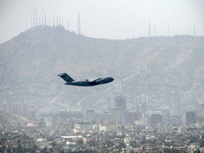 TOPSHOT - An US Air Force aircraft takes off from the airport in Kabul on August 30, 2021. - Rockets were fired at Kabul's airport on August 30 where US troops were racing to complete their withdrawal from Afghanistan and evacuate allies under the threat of Islamic State group attacks. …