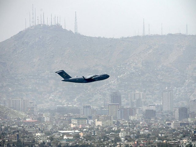 TOPSHOT - An US Air Force aircraft takes off from the airport in Kabul on August 30, 2021. - Rockets were fired at Kabul's airport on August 30 where US troops were racing to complete their withdrawal from Afghanistan and evacuate allies under the threat of Islamic State group attacks. (Photo by Aamir QURESHI / AFP) (Photo by AAMIR QURESHI/AFP via Getty Images)