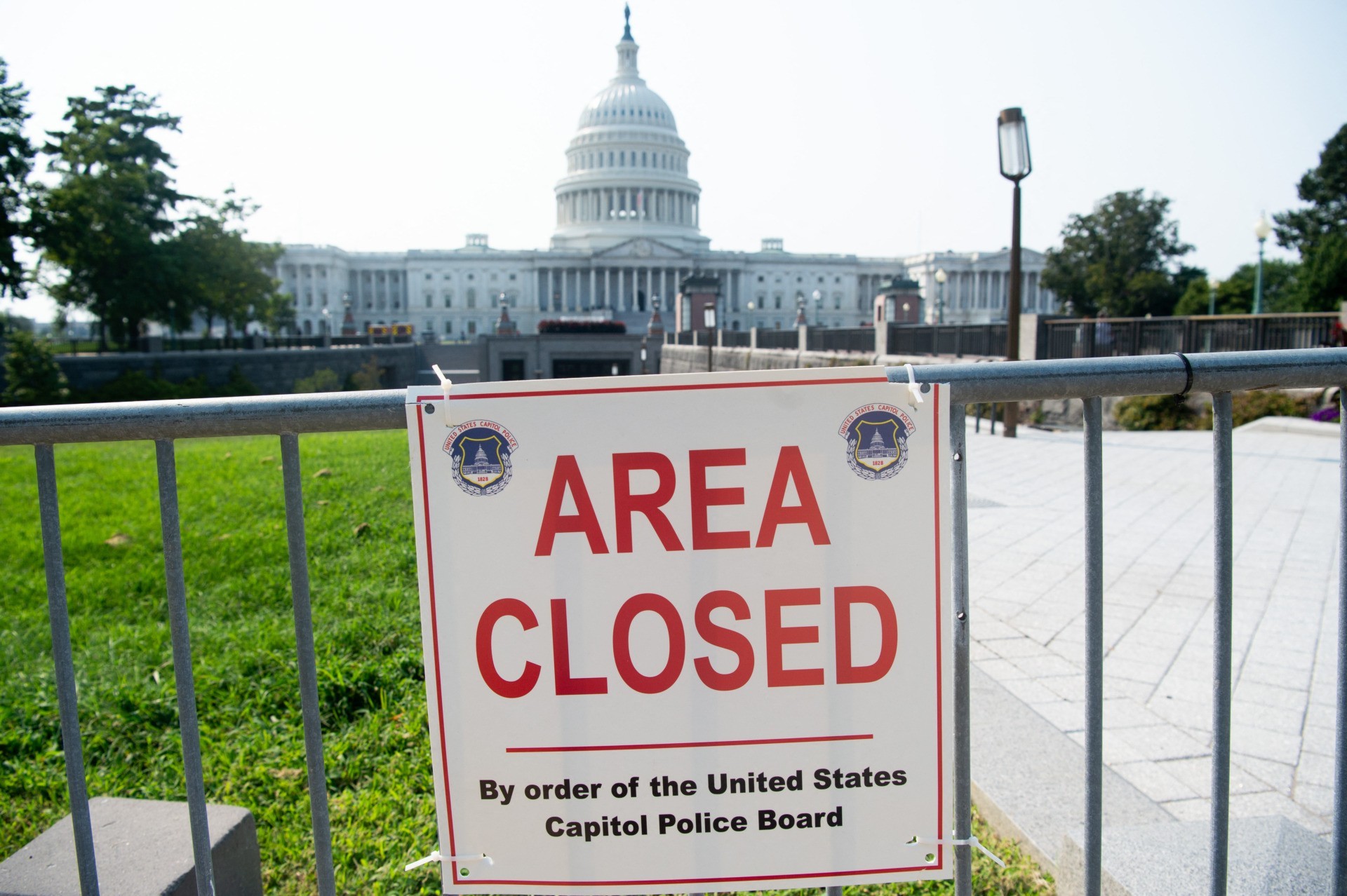 An "Area Closed" sign appears on temporary security fencing outside the US Capitol in Washington, DC, September 13, 2021, as security increases ahead of the planned September 18 rally in support of the January 6 insurrectionists on Capitol Hill. (Photo by SAUL LOEB / AFP) (Photo by SAUL LOEB/AFP via Getty Images)