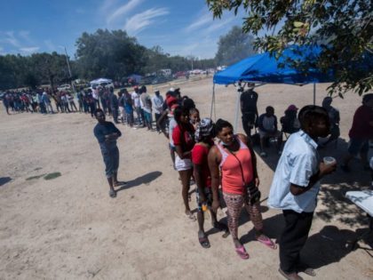 Haitian migrants queue to get food at a shelter in Ciudad Acuna, Coahuila state, Mexico, o