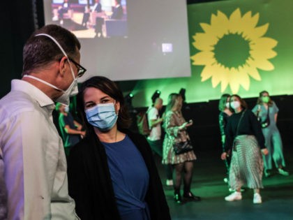 BERLIN, GERMANY - SEPTEMBER 26: Green party (Alliance 90/The Greens) chancellor candidate Annalena Baerbock (C) attends the election party on September 26, 2021 in Berlin, Germany. Voters have gone to the polls nationwide today in elections that herald the end of the 16-year chancellorship of Angela Merkel. (Photo by Filip …