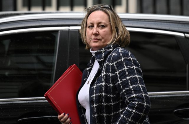 Britain's International Trade Secretary Anne-Marie Trevelyan reacts as she arrives by car
