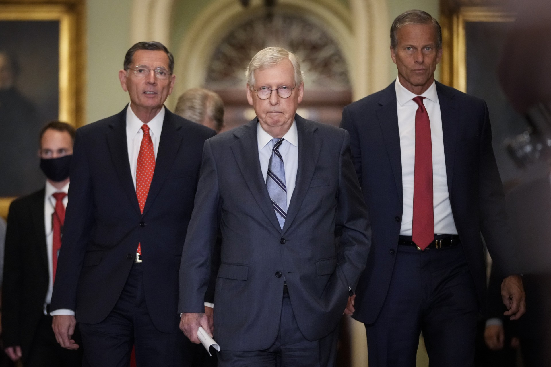 WASHINGTON, DC - SEPTEMBER 28: (L-R) Sen. John Barrasso (R-WY), Senate Minority Leader Mitch McConnell (R-KY) and Sen. John Thune (R-SD) arrive to speak with reporters after a lunch meeting with Senate Republicans at the U.S. Capitol on September 28, 2021 in Washington, DC. Senator McConnell said on Tuesday that his Republican caucus will not assist Democrats in raising the debt ceiling. (Photo by Drew Angerer/Getty Images)