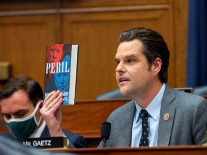 WASHINGTON, DC - SEPTEMBER 29: Rep. Matt Gaetz (R-FL) holds up a copy of the book Peril during a House Armed Services Committee hearing on Ending the U.S. Military Mission in Afghanistan in the Rayburn House Office Building at the U.S. Capitol on September 29, 2021 in Washington, DC. (Photo …