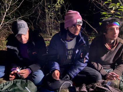 Left to right: Ameer, Hadi, Ali - three Iraqi migrants hiding in a Polish forest near the Polish town of Chelm are pictured shortly after crossing the border from Belarus, on September 30, 2021. - Thousands of migrants, most of them from the Middle East, have crossed or tried to …