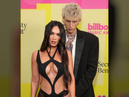 LOS ANGELES, CALIFORNIA - MAY 23: Machine Gun Kelly and Megan Fox poses backstage for the