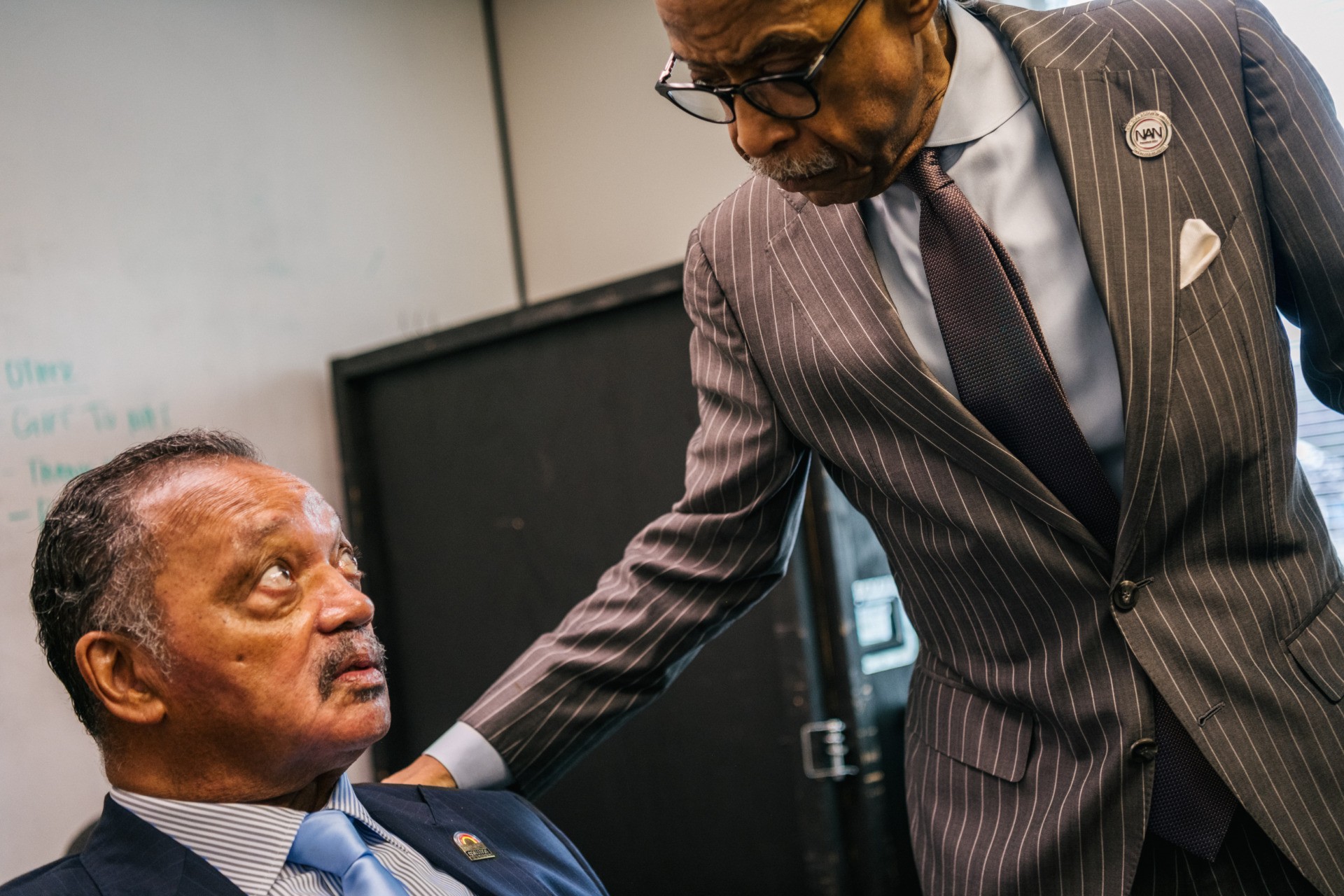 TULSA, OKLAHOMA - JUNE 01: (L-R) Civil Rights leaders Jesse Jackson and Rev. Al Sharpton spend time together ahead of a rally during commemorations of the 100th anniversary of the Tulsa Race Massacre on June 01, 2021 in Tulsa, Oklahoma. President Biden stopped in Tulsa to commemorate the centennial of the Tulsa Race Massacre. May 31st of this year marks the centennial of when a white mob started looting, burning and murdering in Tulsa's Greenwood neighborhood, then known as Black Wall Street, killing up to 300 people and displacing thousands more. Organizations and communities around Tulsa continue to honor and commemorate survivors and community residents. (Photo by Brandon Bell/Getty Images)