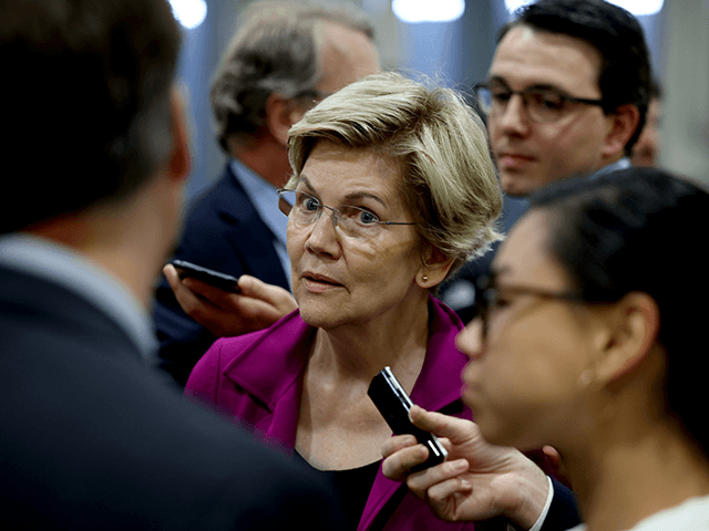 U.S. Sen. Elizabeth Warren (D-MA) speaks to reporters in the Senate subway during a proced