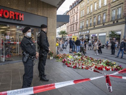 WURZBURG, GERMANY - JUNE 26: People lay flowers near the site of a fatal attack by a knife
