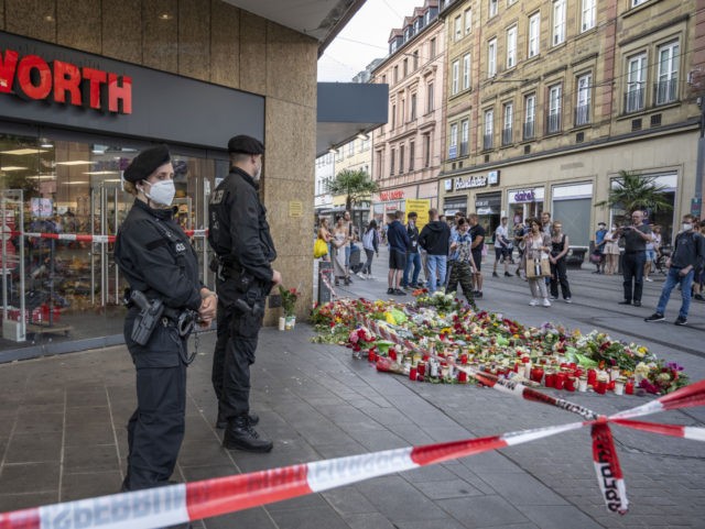 WURZBURG, GERMANY - JUNE 26: People lay flowers near the site of a fatal attack by a knife-wielding man on June 26, 2021 in Wurzburg, Germany. Abdirahman J. A., 24, who arrived in Germany from Somalia in 2015, yesterday stabbed three people fatally apparently at random and injured approximately a …