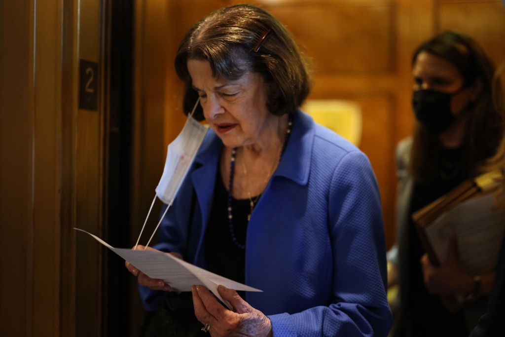 WASHINGTON, DC - AUGUST 02: U.S. Sen. Dianne Feinstein (D-CA) looks at her notes as she walks to the Senate Chambers for a series of amendment votes in the Capitol Building on August 02, 2021 in Washington, DC. The Senate has moved on to the amendments process this week for the legislative text of the $1 trillion infrastructure bill, which aims to fund improvements to roads, bridges, dams, climate resiliency and broadband Internet. (Photo by Anna Moneymaker/Getty Images)
