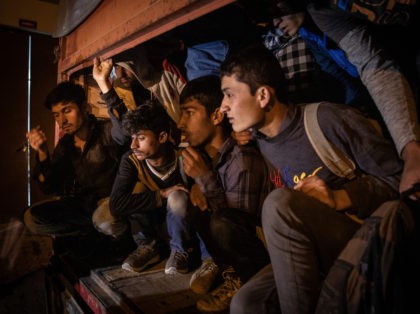 VAN, TURKEY - JULY 10: Afghan migrants wait in a smuggler's truck after it was seized by Jandarma officers during a roadside raid on July 10, 2021 in Van, Turkey. A growing number of Afghan refugees are fleeing into Turkey as the Taliban escalates its military offensive and the United …