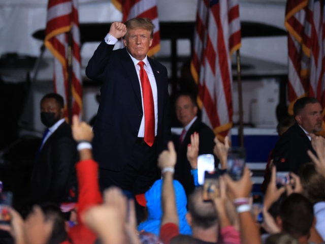 CULLMAN, ALABAMA - AUGUST 21: Former U.S. President Donald Trump pumps his fist as he finishes addressing a "Save America" rally at York Family Farms on August 21, 2021 in Cullman, Alabama. With the number of coronavirus cases rising rapidly and no more ICU beds available in Alabama, the host …