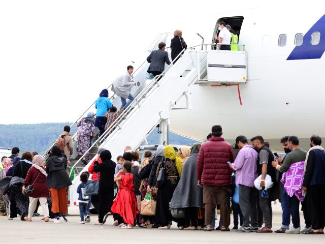 RAMSTEIN-MIESENBACH, GERMANY - AUGUST 26: Evacuees board an Atlas aircraft bringing them f