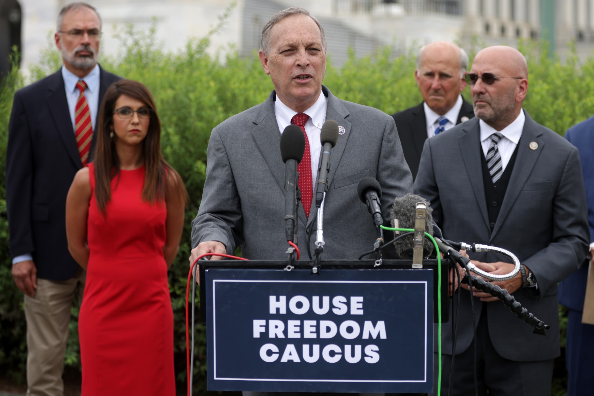 WASHINGTON, DC - AUGUST 31: Chair of the Freedom Caucus U.S. Andy Biggs (R-AZ) (3rd L) speaks as caucus members listen during a news conference in front of the U.S. Capitol August 31, 2021 in Washington, DC. The Freedom Caucus held a news conference to discuss the U.S. withdrawal from Afghanistan and to call on President Joe Biden, Defense Secretary Lloyd Austin and Chairman of the Joint Chiefs of Staff Gen. Mark Milley to resign because of a “disastrous” evacuation operation. The caucus also announced that an impeachment resolution against Secretary of State Antony Blinken has been filed. (Photo by Alex Wong/Getty Images)