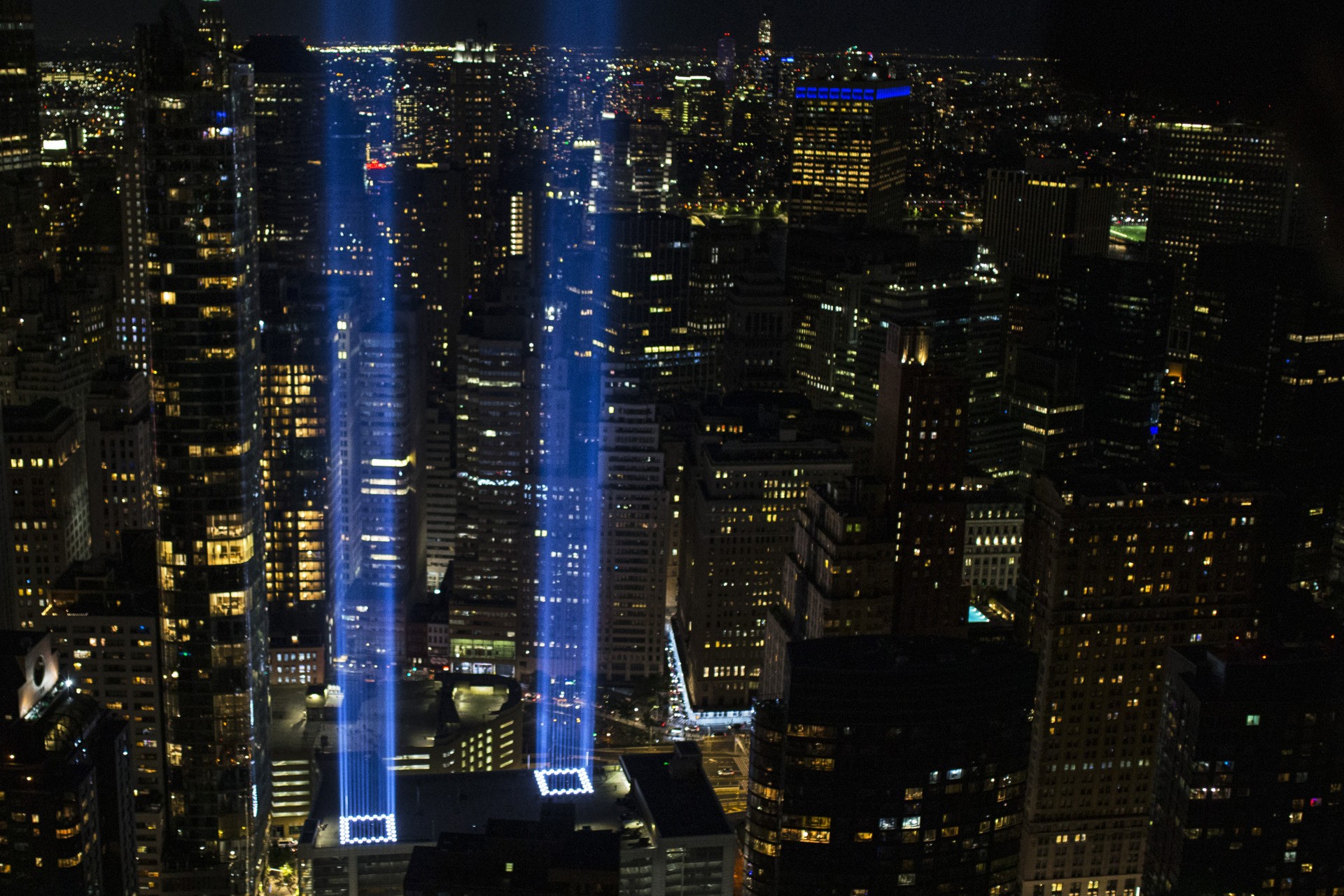 NEW YORK, NEW YORK - SEPTEMBER 11: The Tribute In Light shines up from Lower Manhattan on the 20th Anniversary of the terror attacks on September 11, 2021 in New York City. During the ceremony six moments of silence were held, marking when each of the World Trade Center towers was struck and fell and the times corresponding to the attack on the Pentagon and the crash of Flight 93. The nation is marking the 20th anniversary of the terror attacks of September 11, 2001, when the terrorist group al-Qaeda flew hijacked airplanes into the World Trade Center, Shanksville, PA and the Pentagon, killing nearly 3,000 people. (Photo by Michael M. Santiago/Getty Images)