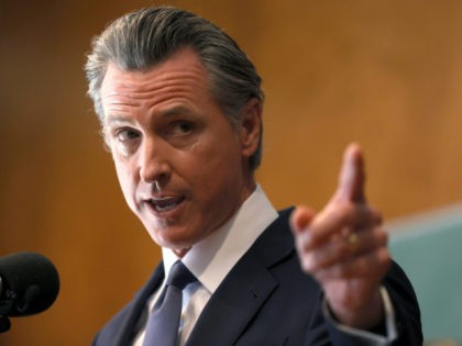 SAN FRANCISCO, CALIFORNIA - SEPTEMBER 14: California Gov. Gavin Newsom speaks to union workers and volunteers on election day at the IBEW Local 6 union hall on September 14, 2021 in San Francisco, California. Californians are heading to the polls to cast their ballots in the California recall election of …