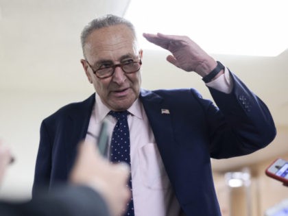 WASHINGTON, DC - SEPTEMBER 23: Senate Majority Leader Chuck Schumer (D-NY) gestures as he speaks with reporters as he walks to a press event at the U.S. Capitol on September 23, 2021 in Washington, DC. Lawmakers continue to work towards coming to an agreement to pass legislation to fund the …