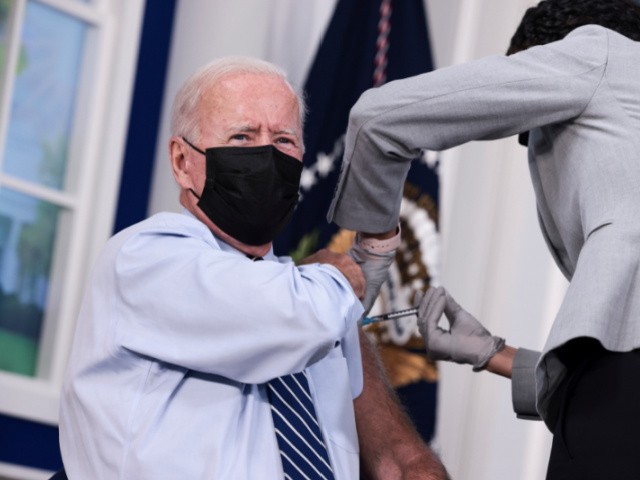 WASHINGTON, DC - SEPTEMBER 27: U.S. President Joe Biden receives a third dose of the Pfizer/BioNTech Covid-19 vaccine in the South Court Auditorium in the White House September 27, 2021 in Washington, DC. Last week President Biden announced that Americans 65 and older and frontline workers who received the Pfizer-BioNTech COVID-19 vaccine over six months ago would be eligible for booster shots. (Photo by Anna Moneymaker/Getty Images)