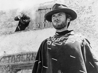 Clint Eastwood is shot at in a scene from the film 'For A Few Dollars More', 1965. (Photo by United Artists/Getty Images)