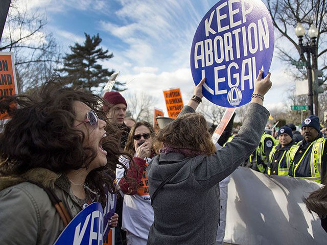 Pro-choice activists block the road against US Capitol Police, who are escorting the March For Life's path, in front of the US Supreme Court in Washington, DC, January 22, 2015. Tens of thousands of Americans who oppose abortion are in Washington for the annual March for Life, marking the 42nd …
