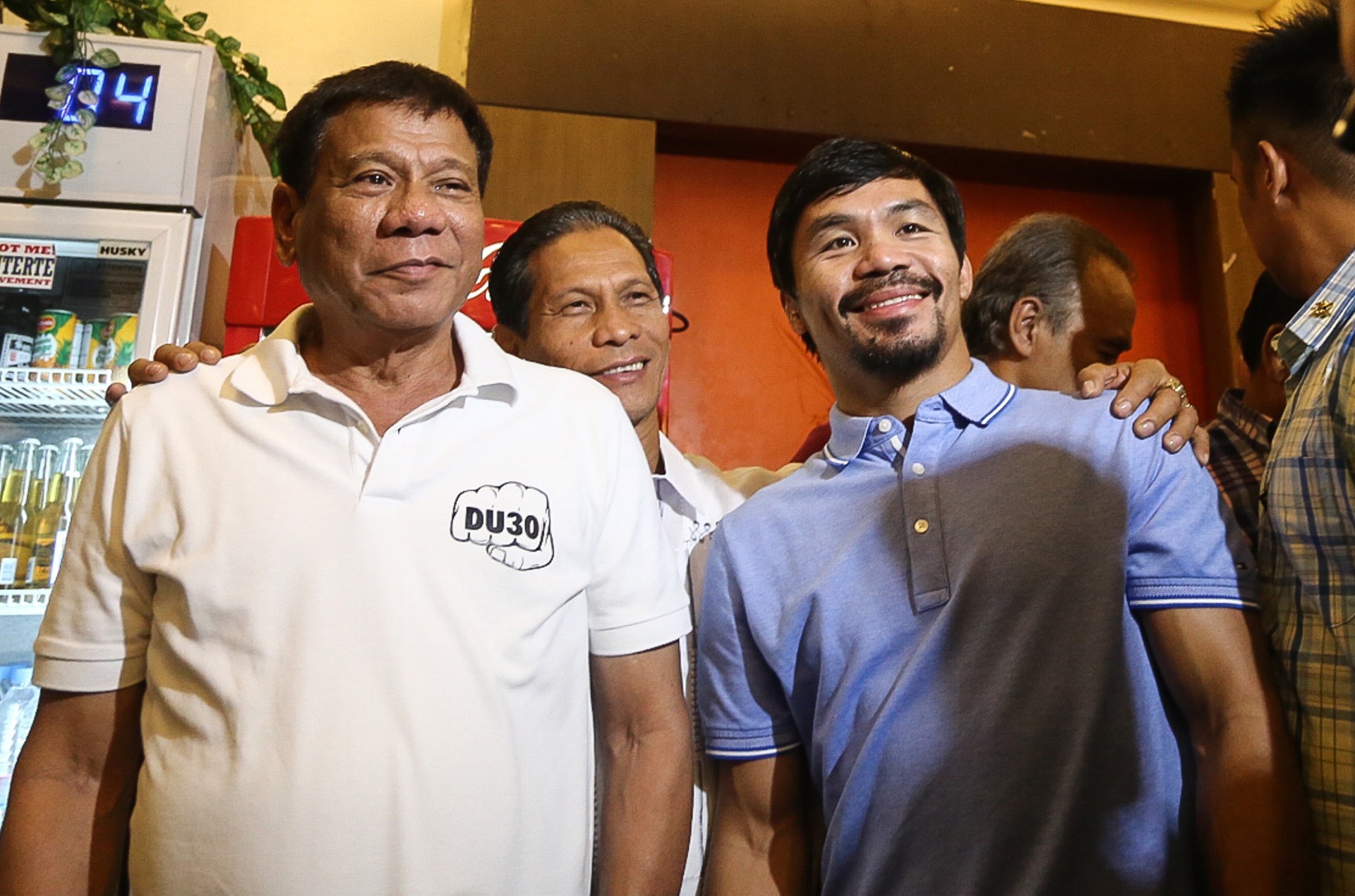 Philippines' President-elect Rodrigo Duterte (L) stands beside boxing icon and newly elected Senator Manny Pacquiao (R) at a meeting in Davao in southern island of Mindanao on May 28, 2017. Philippine police shot dead four suspected drug dealers while unknown men gunned down two others, officials said Saturday, raising the death toll for narcotics suspects to 14 this week after president-elect Rodrigo Duterte vowed a war against crime. / AFP / MANMAN DEJETO (Photo credit should read MANMAN DEJETO/AFP via Getty Images)