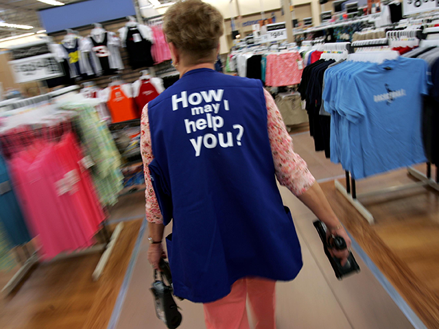 Barbara Kokensparger, who has been working with Wal-Mart for the past 11 years, walks to the children's clothing area to scan items at the new 2,000 square foot Wal-Mart Supercenter store May 17, 2006 in Bowling Green, Ohio. The new store, one of three new supercenters opening today in Ohio, …