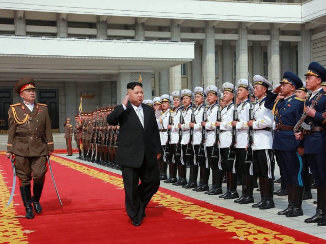 This April 15, 2017 picture released from North Korea's official Korean Central News Agency (KCNA) on April 16, 2017 shows North Korean leader Kim Jong-Un (C) arriving for a military parade in Pyongyang marking the 105th anniversary of the birth of late North Korean leader Kim Il-Sung. / AFP PHOTO …