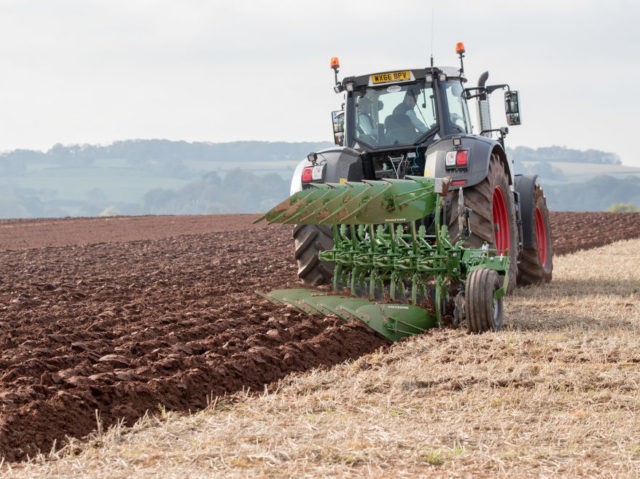 TAUNTON, ENGLAND - OCTOBER 15: A modern tractor is used to plough a field at the 67th Bri