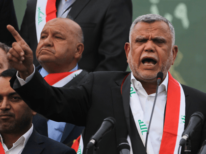 Hadi al-Amiri, head of the Iranian-backed Badr Organization and leader of the Fateh Alliance, a coalition of Iranian-supported militia groups, speaks during a campaign rally in Baghdad on May 7, 2018, ahead of Iraq's parliamentary elections to be held on May 12. (Photo by AHMAD AL-RUBAYE / AFP) (Photo credit …
