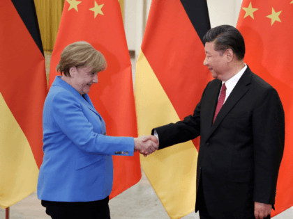 BEIJING, CHINA - MAY 24: China's President Xi Jinping (R) meets German Chancellor Angela Merkel at the Great Hall of the People in Beijing, China, May 24, 2018. (Photo by Jason Lee - Pool/Getty Images)