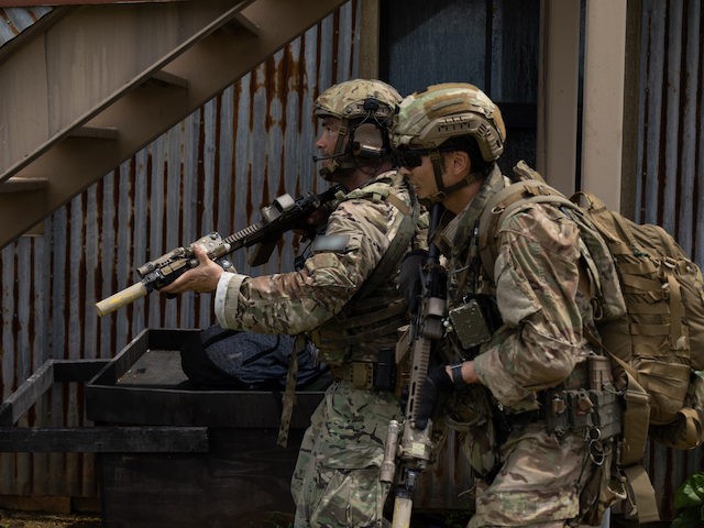 SANTA RITA, Guam – U.S. Army Green Berets assigned to 1st Battalion, 1st Special Forces Group (Airborne), move through an objective area at Naval Base Guam July 30, 2021. Defender Pacific 21 is one of many U.S. Army Pacific exercises and activities occurring during summer 2021 which implements the National …