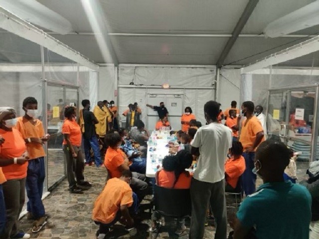 A group of Haitian migrants dine in a Border Patrol detention facility in the Tucson Sector on September 24. (Photo: U.S. Border Patrol )