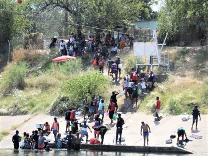 The stream of mostly Haitian migrants crossing the Rio Grande continued on Saturday and th