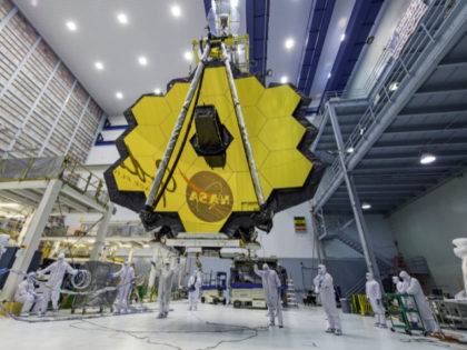 In this April 13, 2017 photo provided by NASA, technicians lift the mirror of the James Webb Space Telescope using a crane at the Goddard Space Flight Center in Greenbelt, Md. The telescope’s 18-segmented gold mirror is specially designed to capture infrared light from the first galaxies that formed in …
