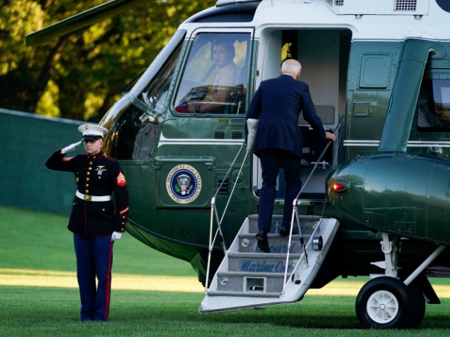 President Joe Biden boards Marine One on the South Lawn of the White House, Friday, Sept. 24, 2021, in Washington. First lady Jill Biden is seated at right. (AP Photo/Evan Vucci)