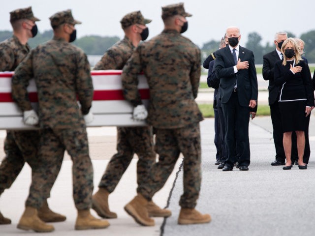 US President Joe Biden(C) attends the dignified transfer of the remains of a fallen service member at Dover Air Force Base in Dover, Delaware, August, 29, 2021, one of the 13 members of the US military killed in Afghanistan last week. - President Joe Biden prepared Sunday at a US …