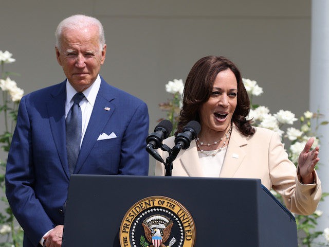 U.S. Vice President Kamala Harris delivers remarks as U.S. President Joe Biden looks on in