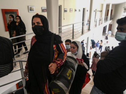Members of Afghanistan's national girls football team arrive at the Pakistan Football Federation (PFF) in Lahore on September 15, 2021, a month after the hardline Taliban swept back into power officials said. (Photo by Arif ALI / AFP) / The erroneous mention[s] appearing in the metadata of this photo by …