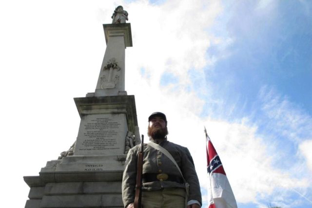 In this July 10, 2017, file photo, Cameron Maynard stands at attention by the monument to Confederate soldiers at the South Carolina Statehouse in Columbia, S.C. The South Carolina Supreme Court has upheld a 2000 law protecting Confederate monuments from being moved without a vote from the General Assembly. (AP …