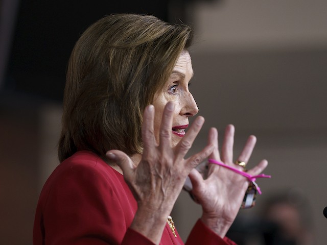 Speaker of the House Nancy Pelosi (D-CA) meets with reporters to discuss President Joe Biden's domestic agenda including passing a bipartisan infrastructure bill and pushing through a Democrats-only expansion of the social safety net, the at the Capitol in Washington, Sept. 8, 2021. (AP Photo/J. Scott Applewhite)