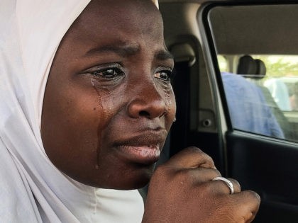 A kidnapped girl, reacts as she prepares to reunite with family members in Jangebe, Zamfara state, on March 3, 2021 after they were kidnapped from a boarding school in northwestern Nigeria, last week on February 26, 2021. - Hundreds of girls who were kidnapped from a boarding school in northwestern …