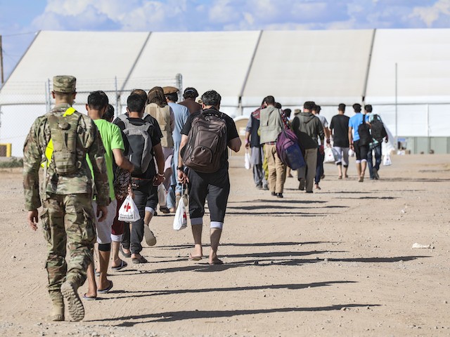 Soldiers with 1st Battalion, 6th Infantry Regiment, 2nd Armored Brigade Combat Team, 1st Armored Division escort Afghan evacuees to their living accommodations at Fort Blissâ€™ DoÃ±a Ana Complex in New Mexico, Aug. 31, 2021. The Department of Defense, through U.S. Northern Command, and in support of the Department of Homeland Security, is providing transportation, temporary housing, medical screening, and general support for at least 50,000 Afghan evacuees at suitable facilities, in permanent or temporary structures, as quickly as possible. This initiative provides Afghan personnel essential support at secure locations outside Afghanistan. (U.S. Army photo by: Staff Sgt. Michael West, 1st Armored Division, 2nd Armored Brigade Combat Team)