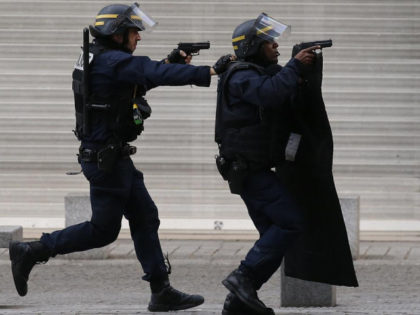 FILE - In this Nov. 18, 2015 file photo armed police operate in Saint-Denis, a northern su